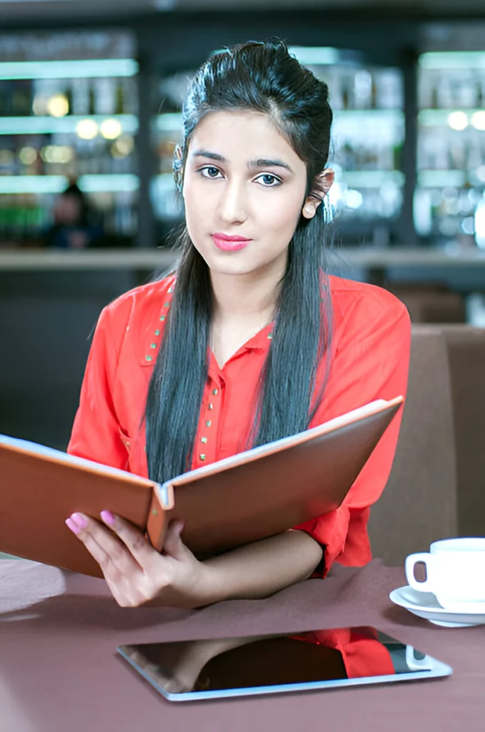 Girl wearing invisible hearing aid in a cafe pearlhearingaid dunlop