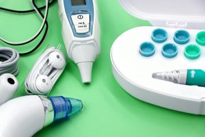 A variety of ear care devices including ear buds, medical instruments, and cleaning tools.