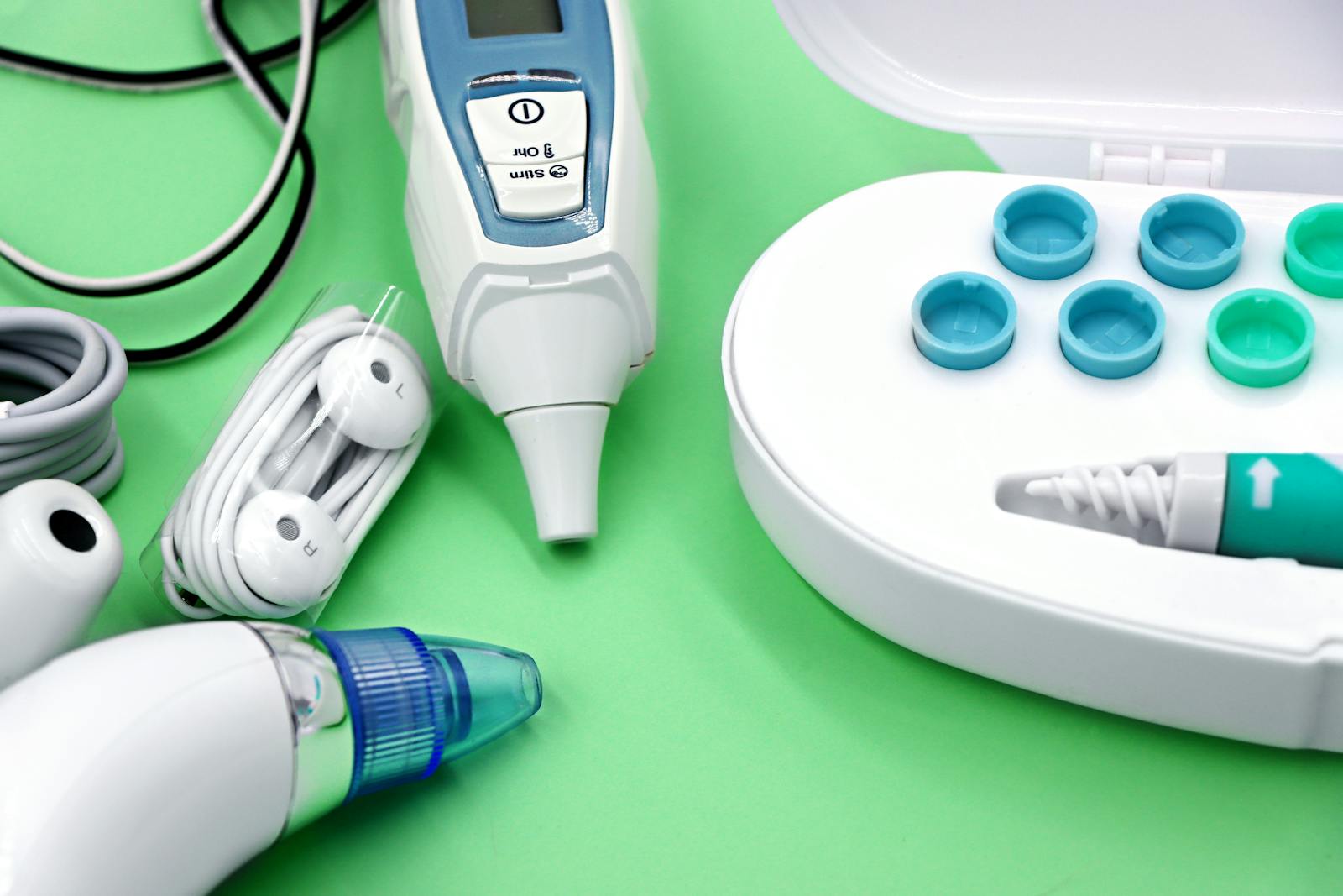 A variety of ear care devices including ear buds, medical instruments, and cleaning tools.